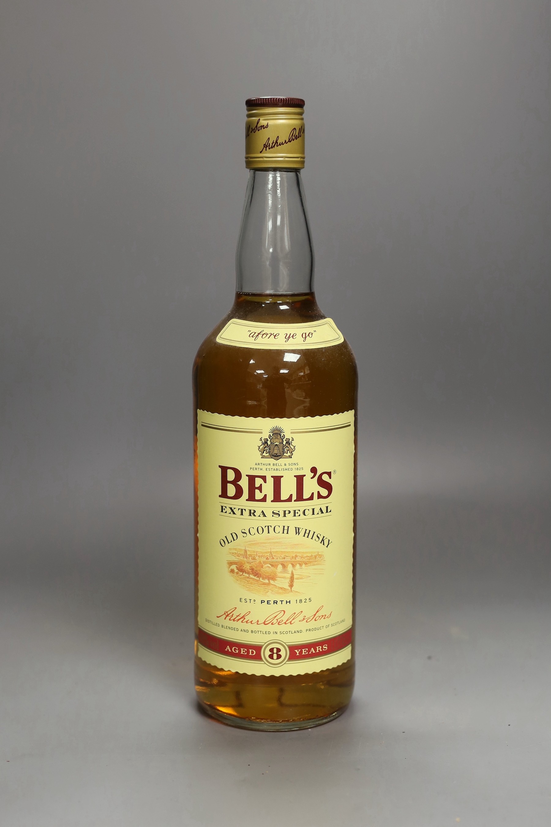 8 single 1 litre bottles of Bells Scotch whisky, 7 aged 8 years